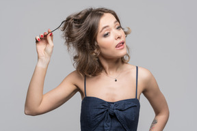 A young woman winding her hair