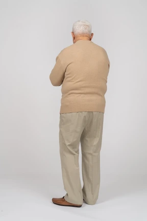 Rear view of an old man in casual clothes
