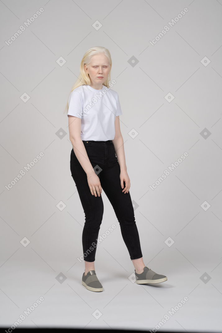 Girl standing on bent leg