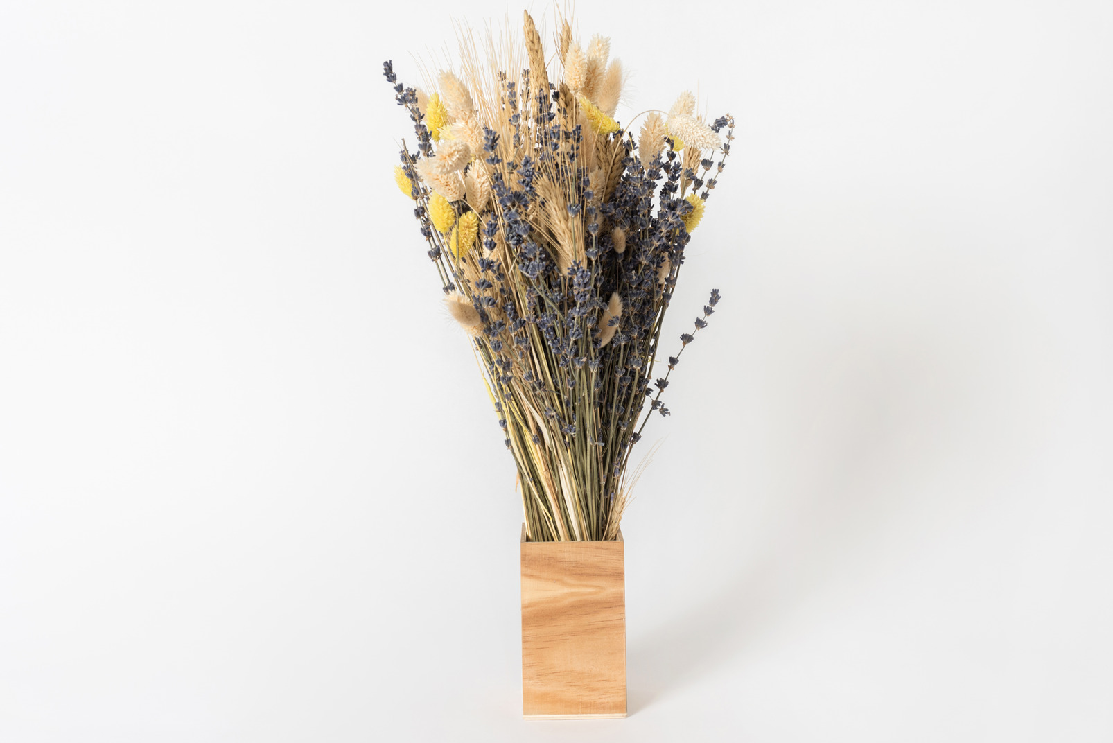 Dried flowers in wooden vase