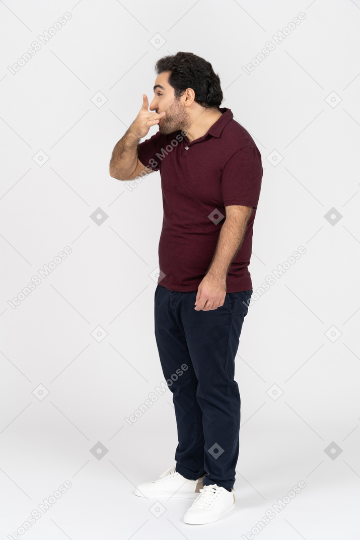 Man in casual clothes whistling