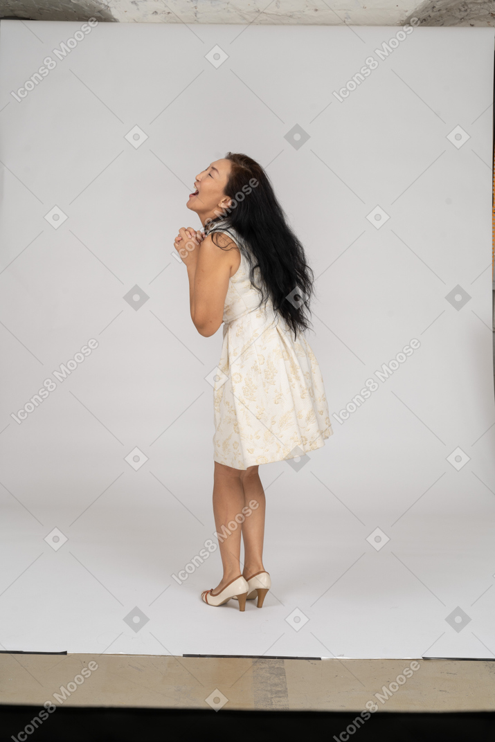 Woman in a white dress standing