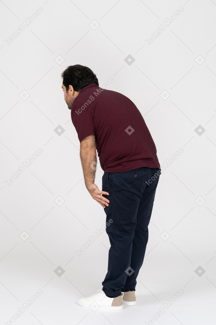 Man in casual clothes bending forward