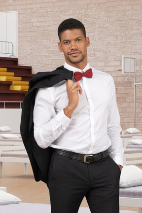 A man in a white shirt and red bow tie