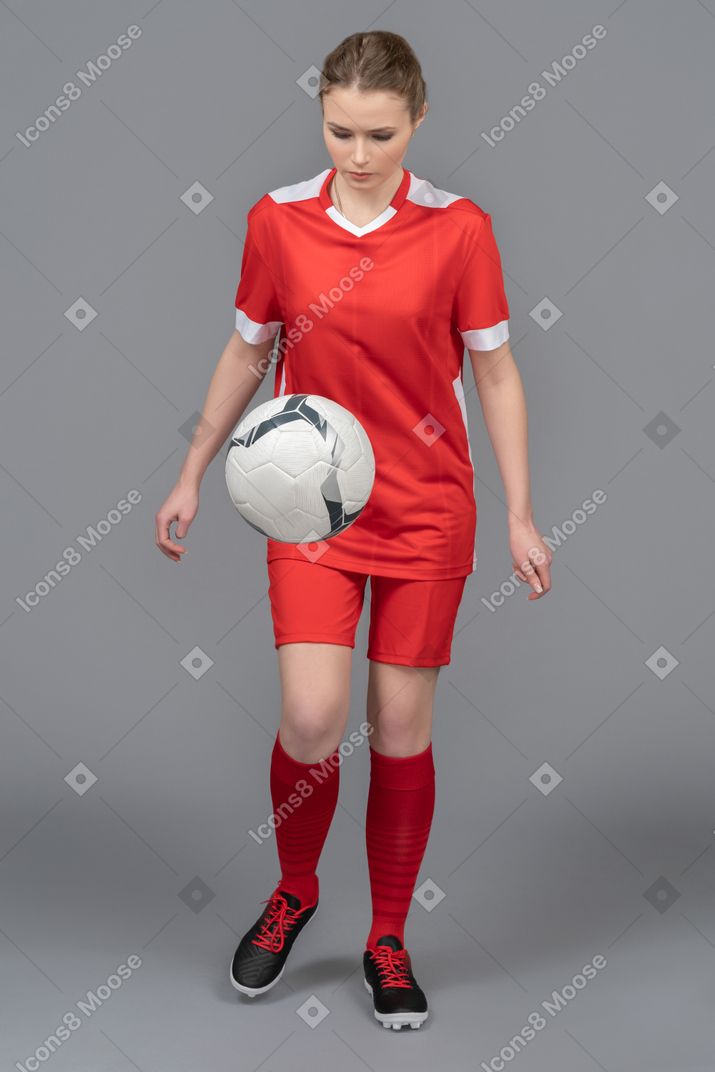 A female player juggling a ball
