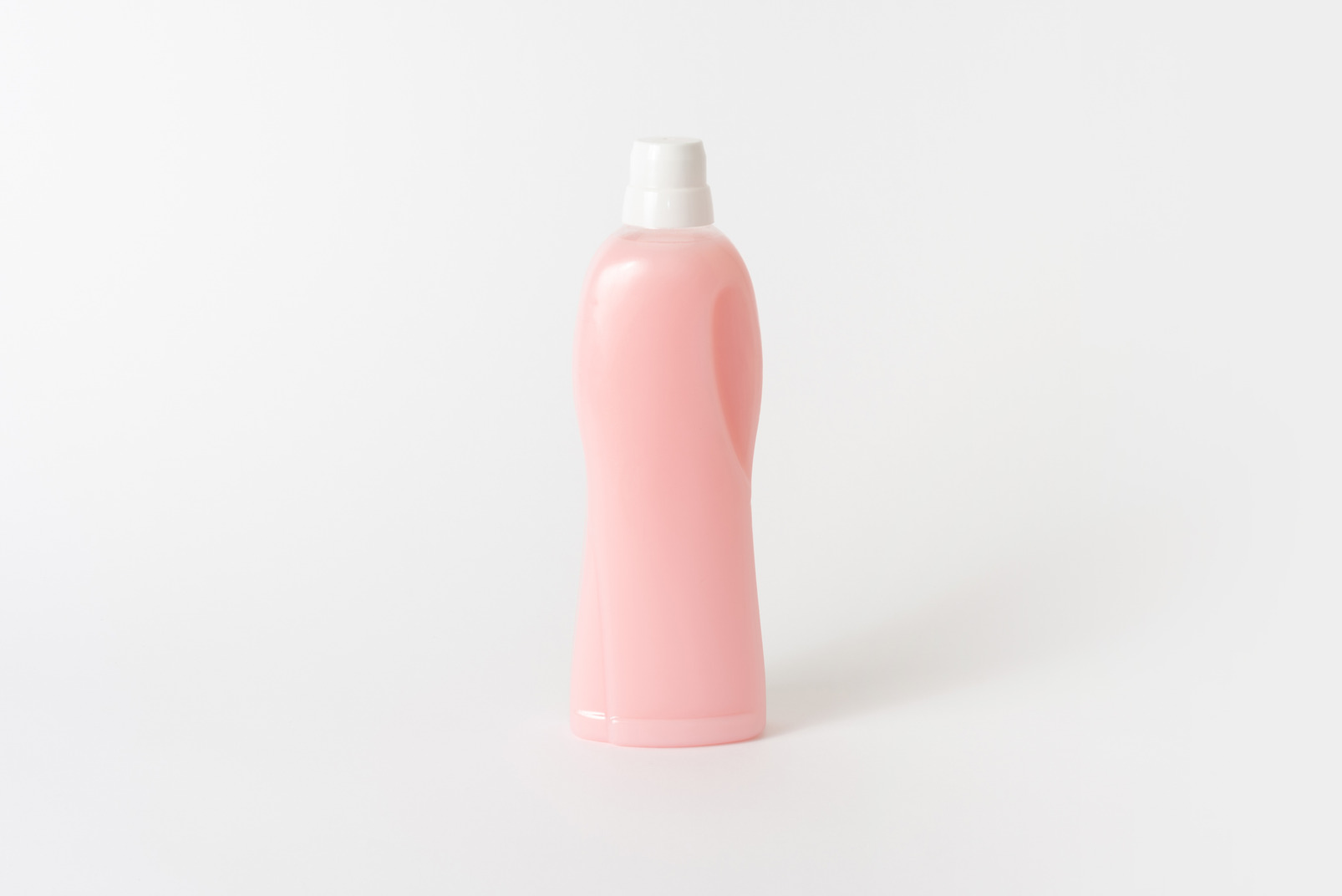 Pink household bottle with white cap