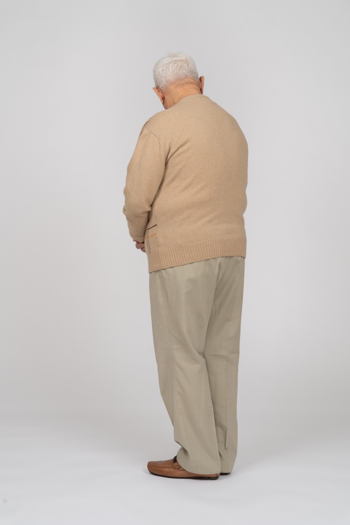 Rear view of an old man in casual clothes Photo