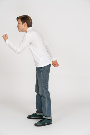 Young man in casual clothes standing