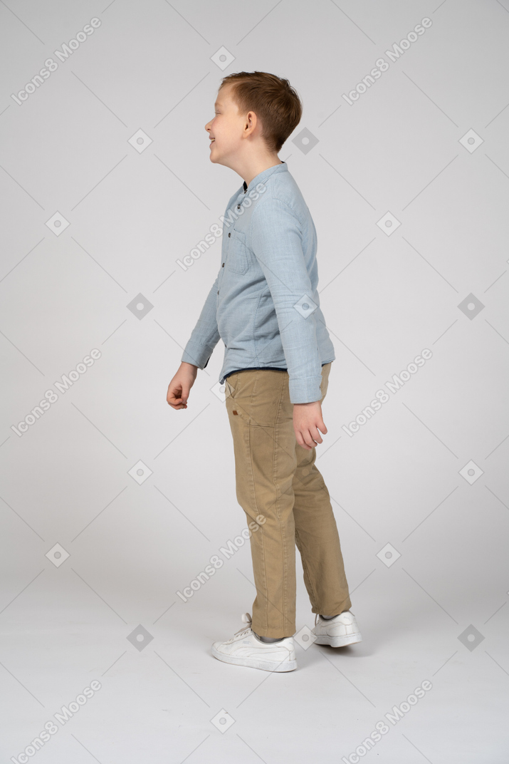 Side view of a boy walking