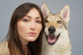 Close-up of a female master with her dog