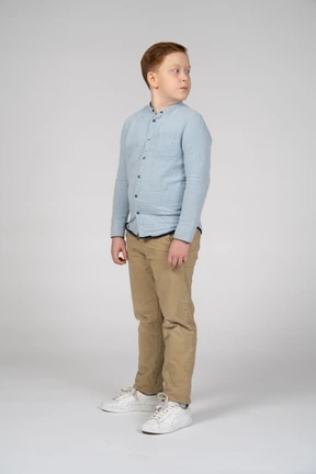 Three-quarter view of a cute boy looking aside