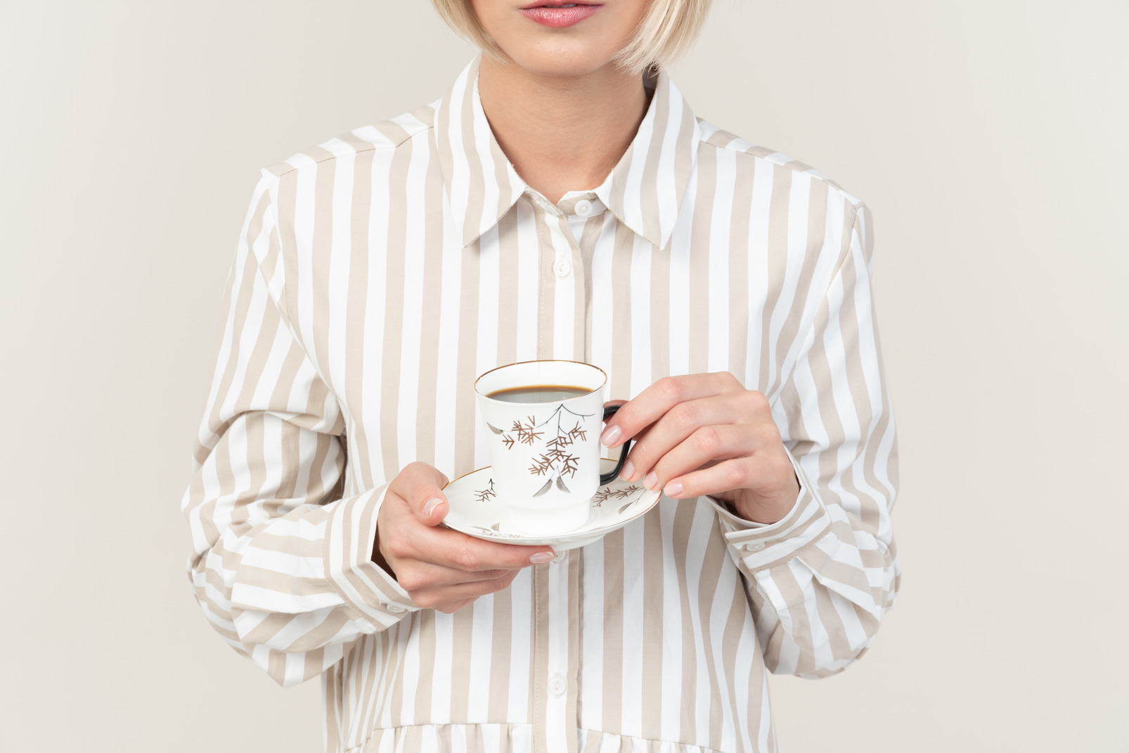 Female hands holding cup of tea