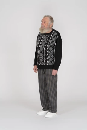 Side view of an old bearded man standing