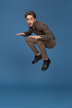 A jumping slim young man