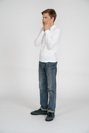 Young man in casual clothes standing