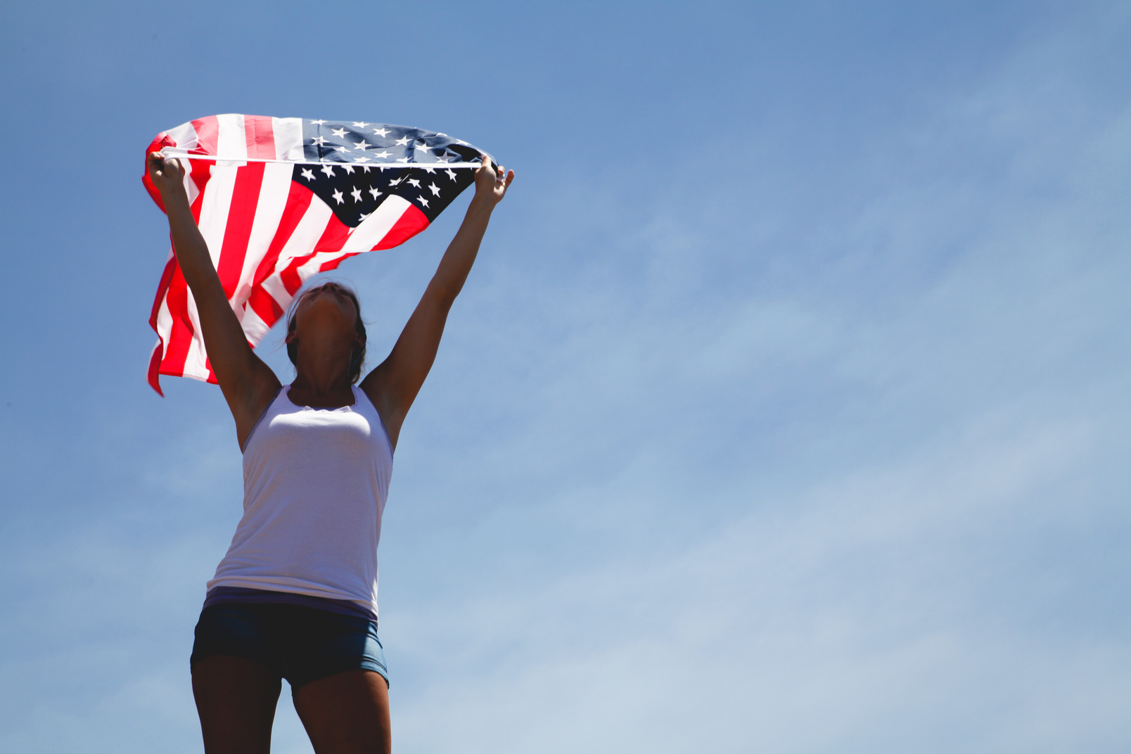 Woman holding american flag