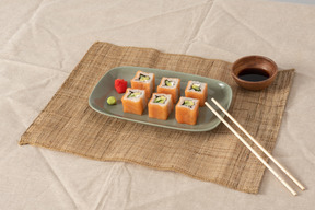 A set of sushi rolls on a platter