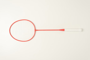 Red tennis racket on a white backgroud