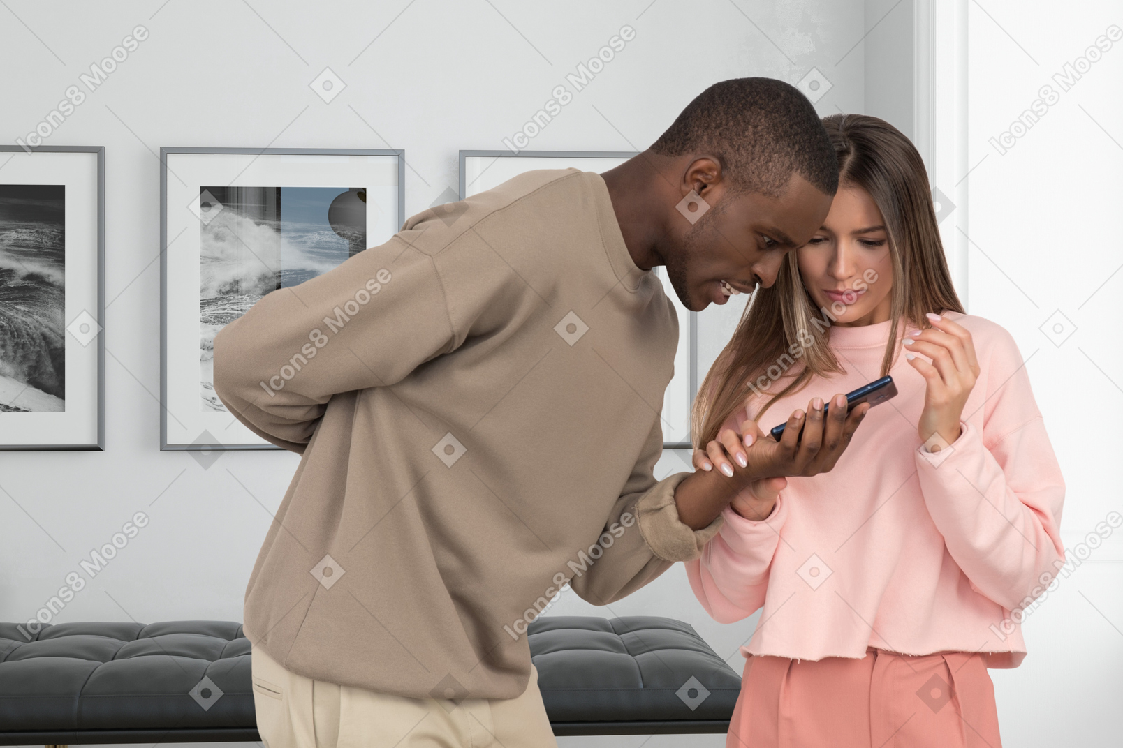 A man and a woman looking at a cell phone