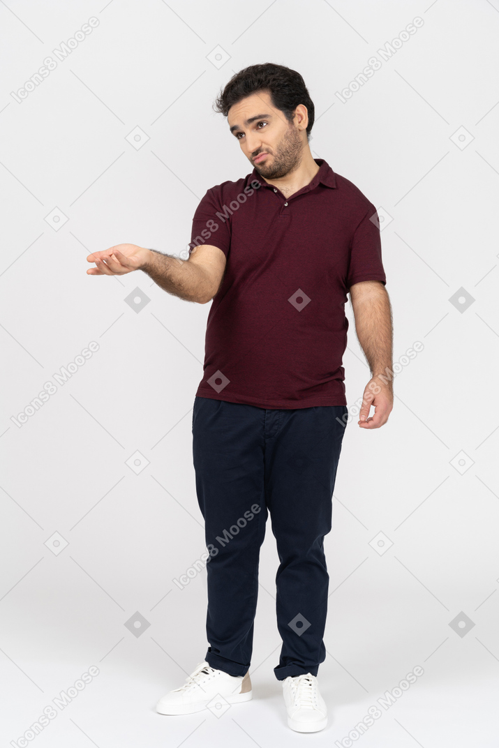 Sad man in casual clothes holding out his hand