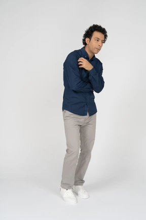 Front view of a man in casual clothes posing