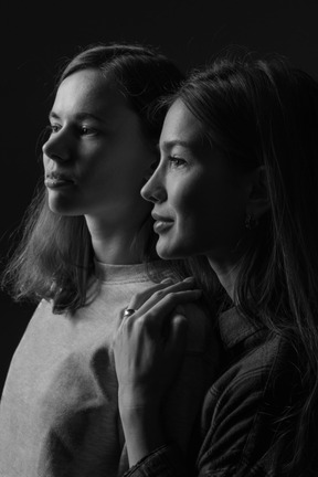 A black and white photo of two women
