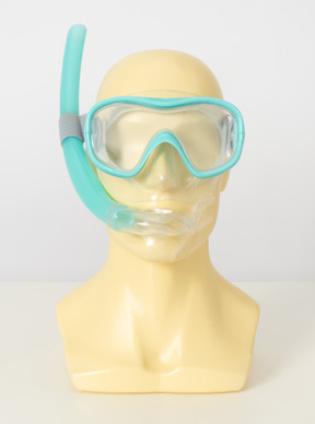 Mannequin head with turquoise diving mask