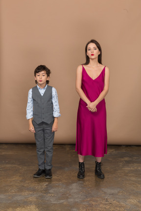 Young girl and a boy standing together