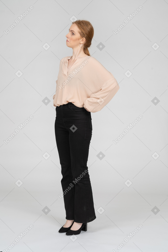 Woman in beautiful blouse standing