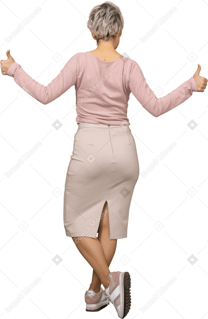 Rear view of a woman in casual clothes showing thumbs up
