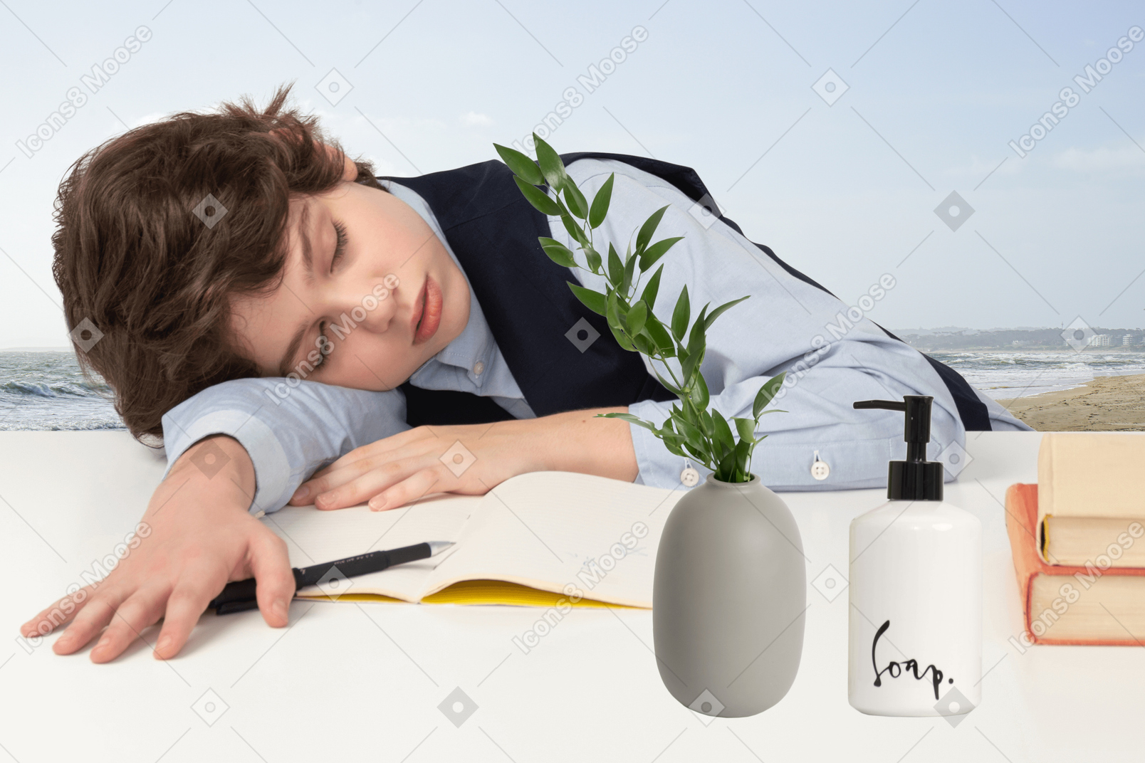 A young boy is sleeping on a table with books and a plant