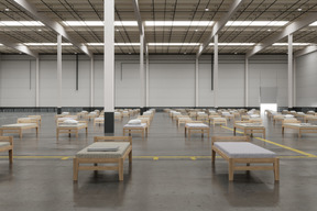 Spacious warehouse with hospital beds