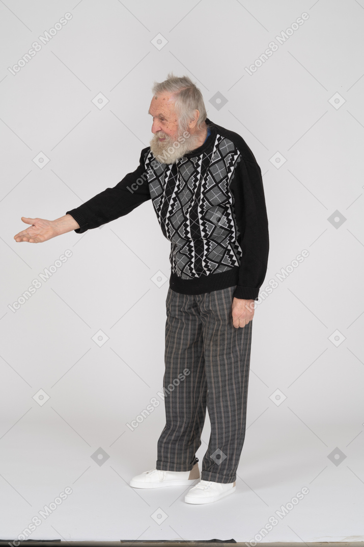 Old man outstretching hand and gesturing