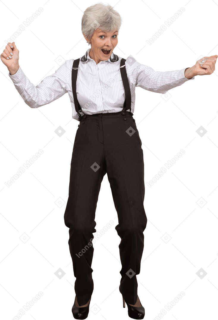 Front view of a happy old lady in office clothing raising hands while screaming