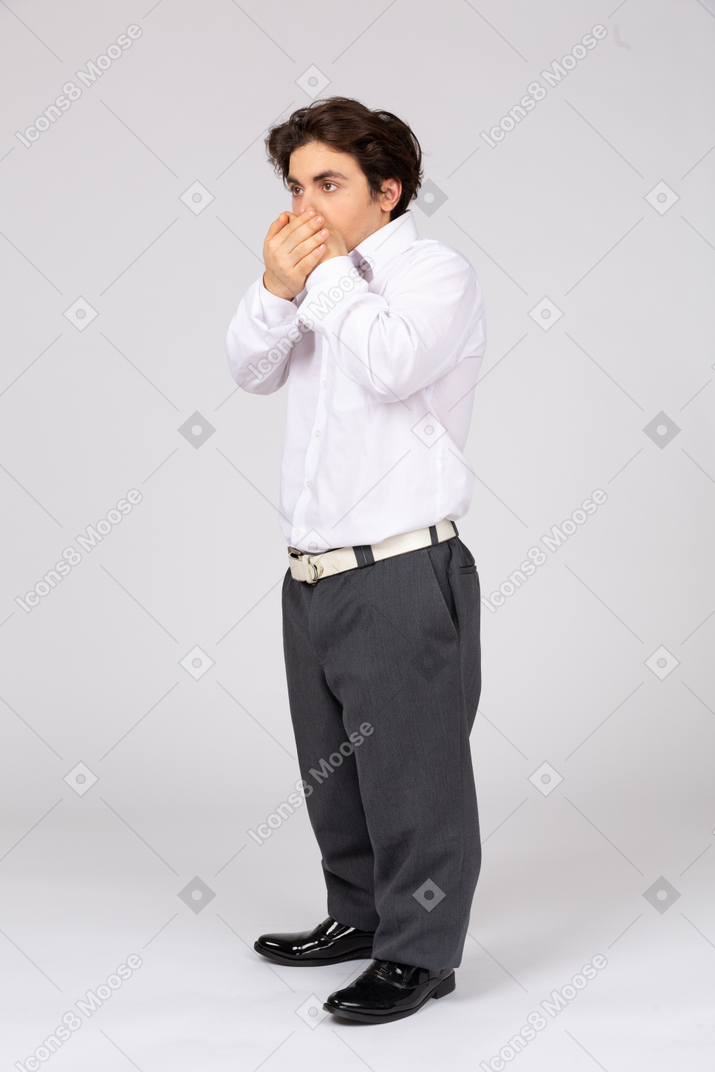 Man covering mouth with hands