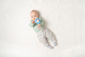 Baby girl holding toys