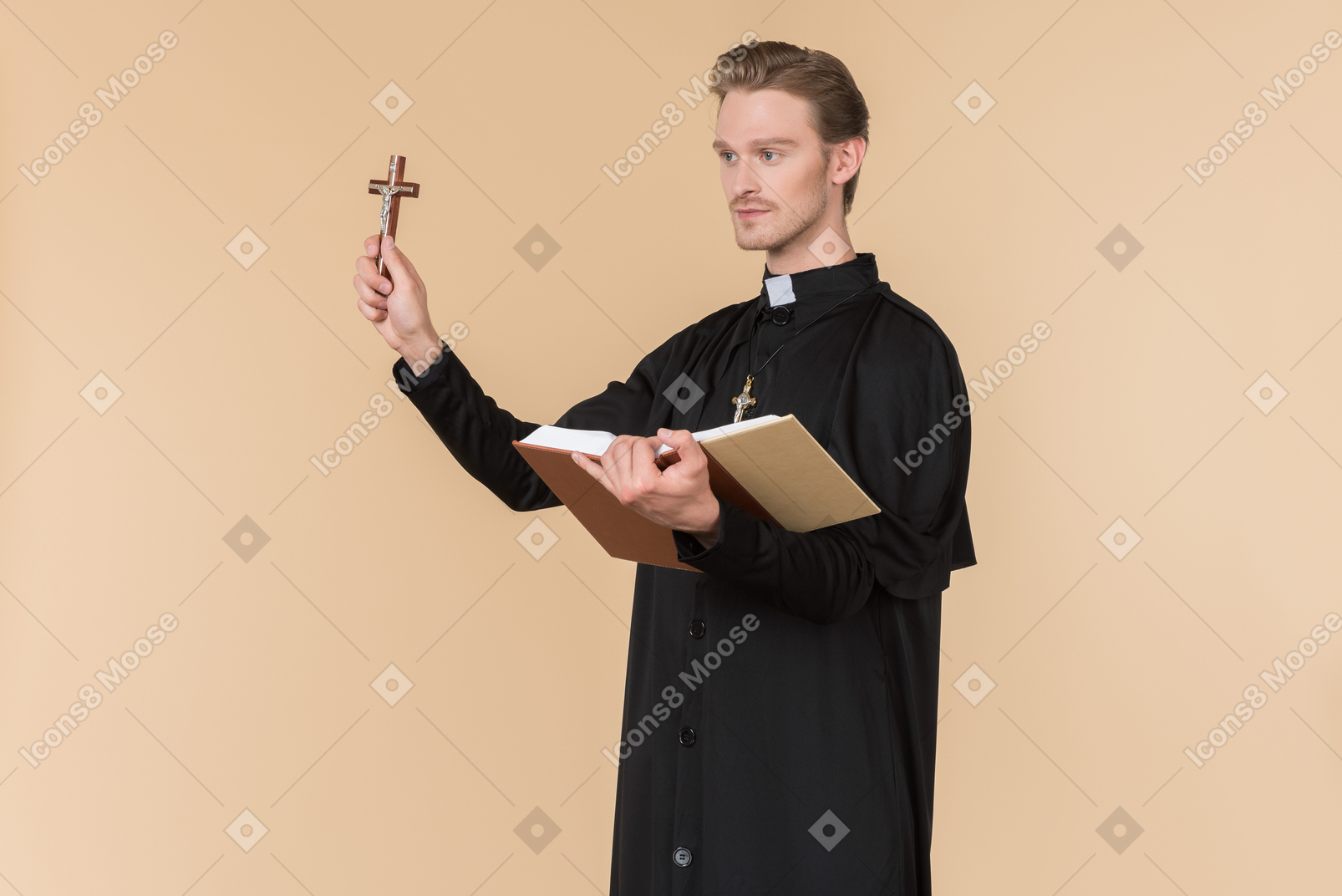 Catholic priest holding cross and reading a bible