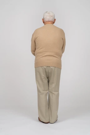 Rear view of an old man in casual clothes