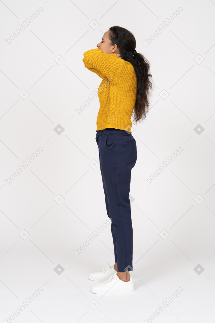 Side view of a girl in casual clothes suffering from pain in neck