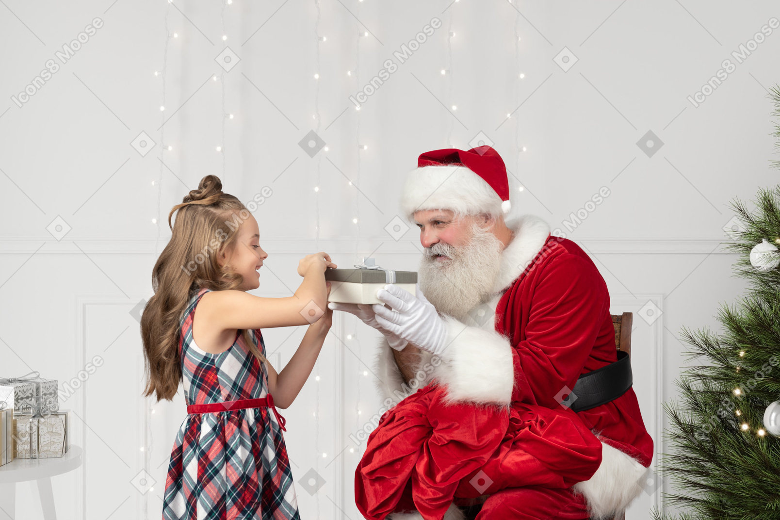 Little girl opening her gift from santa claus