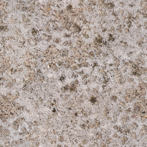 Old concrete wall with gravel inclusions