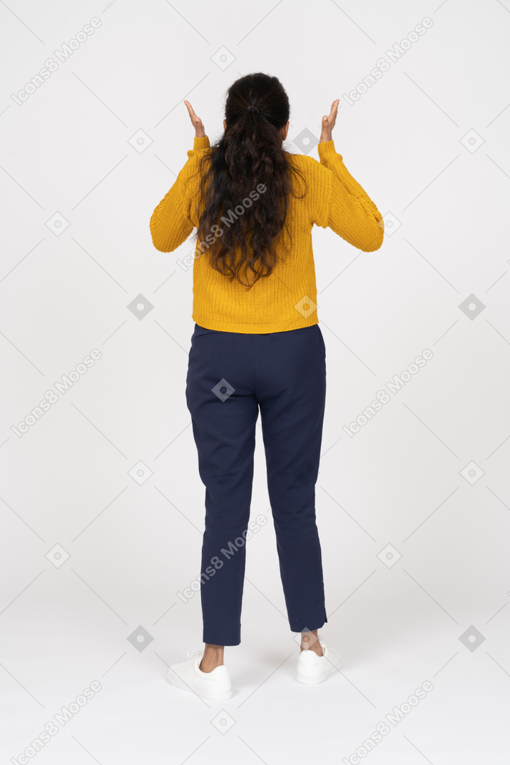 Rear view of an angry girl in casual clothes