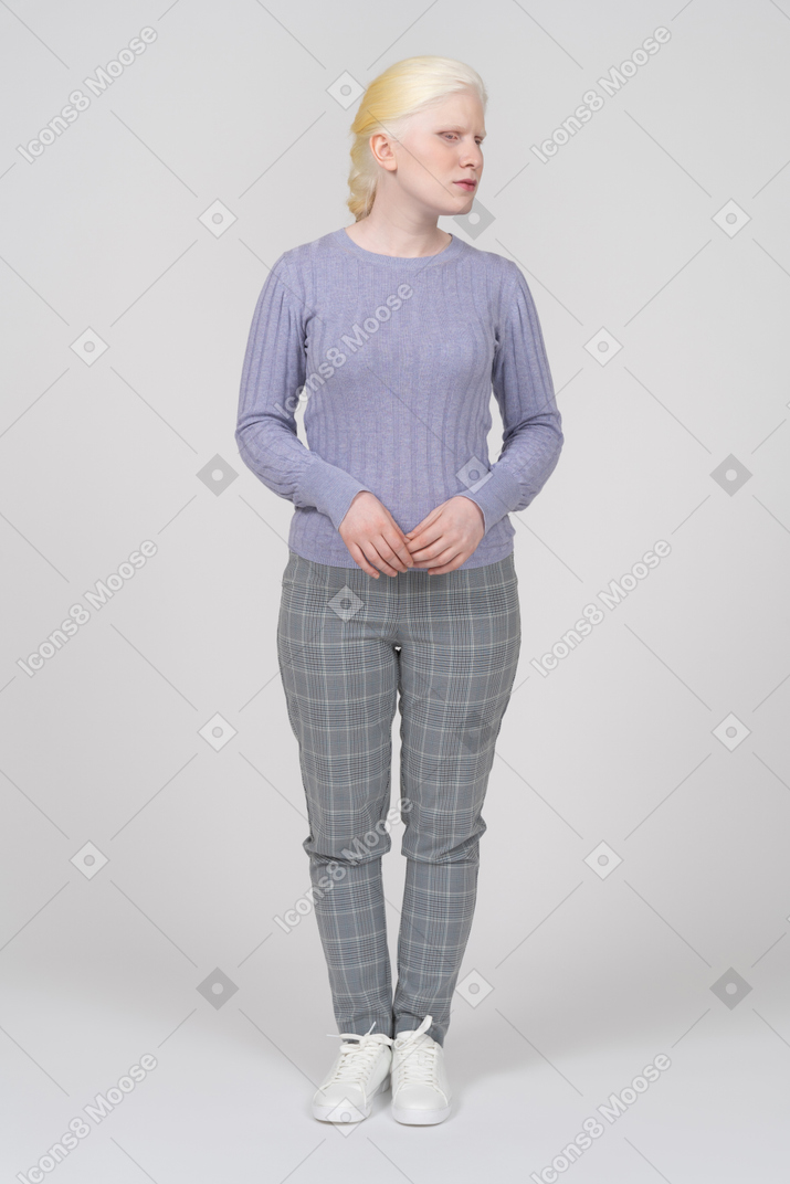 Blonde woman in casual clothes looking right