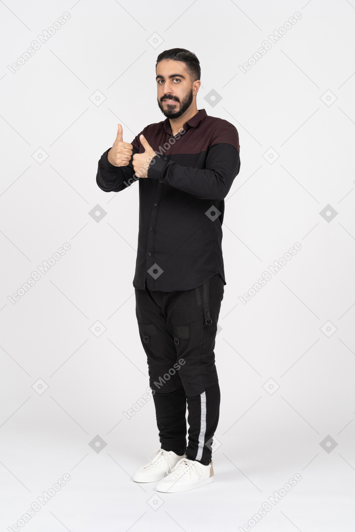 Uncertain man showing two thumbs up