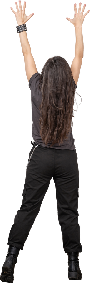 Back view of an unrecognizable female outstretching her hands