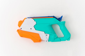 Colored toy gun on a white background
