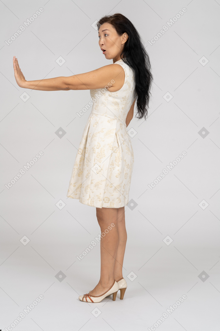 Woman in a white dress standing