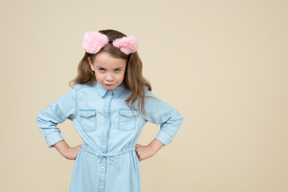 Cute little girl looking from under her eyebrows