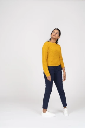 Front view of a girl in casual clothes looking up