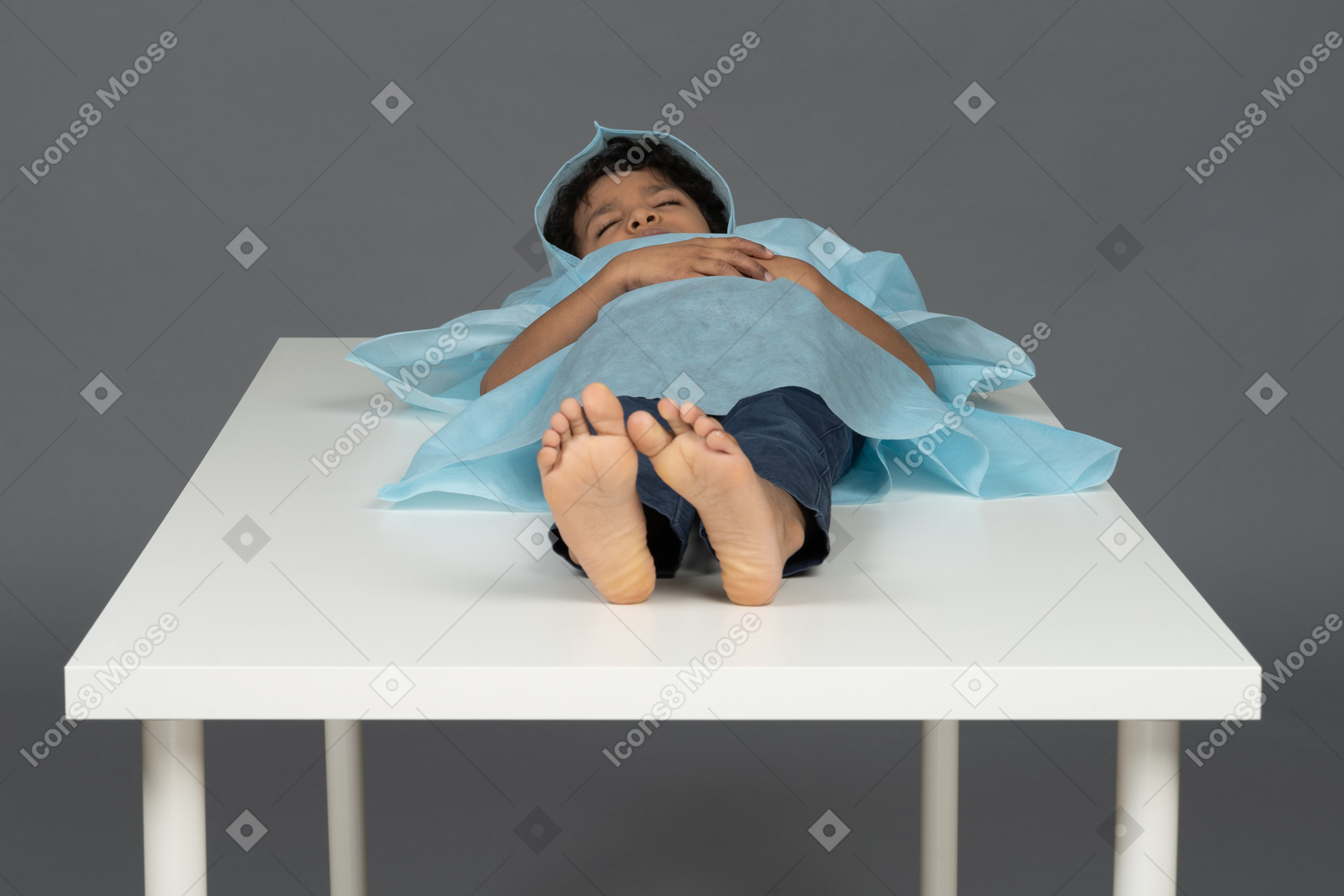 Kid lying down on the table